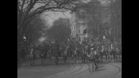 CIRCA 1923 - President Coolidge's motorcade drives down Pennsylvania Avenue in Washington DC after his inauguration ceremony.
