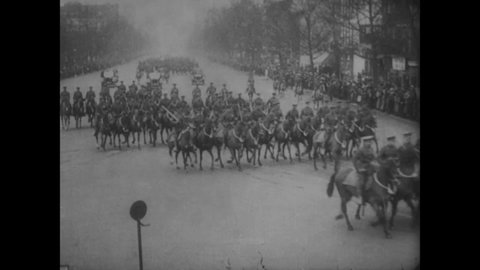 CIRCA 1923 - President Coolidge's motorcade drives down Pennsylvania Avenue in Washington DC on inauguration day, escorted by cavalrymen.