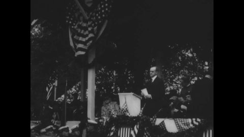 CIRCA 1920s - President Coolidge, General Pershing, and Secretary Weeks give speeches at an outdoor event.