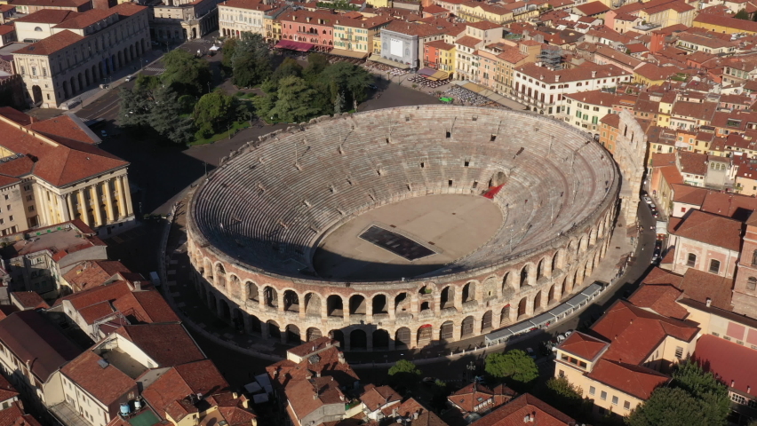 Flying a drone in a circle over the amphitheater in Verona, Italy. Historic center of Verona aerial view. Royalty-Free Stock Footage #1090048721