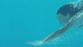 Animation of caucasian female swimmer diving over caucasian female swimmer swimming. global sport concept digitally generated video.