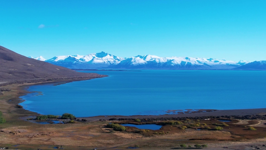 Patagonia Argentina. Famous road at town of El Calafate at Patagonia Argentina. Patagonia road landscape. Amazing landscape of desert scenery with nevada mountain. El Calafate at Patagonia Argentina.
