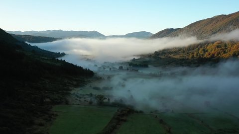 Aerial view of a foggy landscape in Abruzzo national park, sunny, fall day in Italy