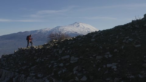 Trekking on the Nebrodi mountains with a view of the Etna volcano in Sicily. Views and climbing with Etna in the background, lake with a view of Etna. Winter in Sicily. Sicilian sunsets.