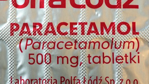 Krakow, Malopolska, Poland - May 2022: Paracetamol, Paracetamolum, acetaminophen 500 mg pills, painkillers, fever, pain medication pack simple concept, nobody, object detail, extreme closeup