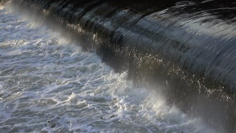 Water at the weir of a hydroelectric power plant