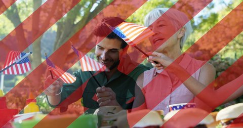 Animation of white and red stripes and human silhouette over diverse senior woman and young man. presidents day, independence day and american patriotism concept digitally generated video.