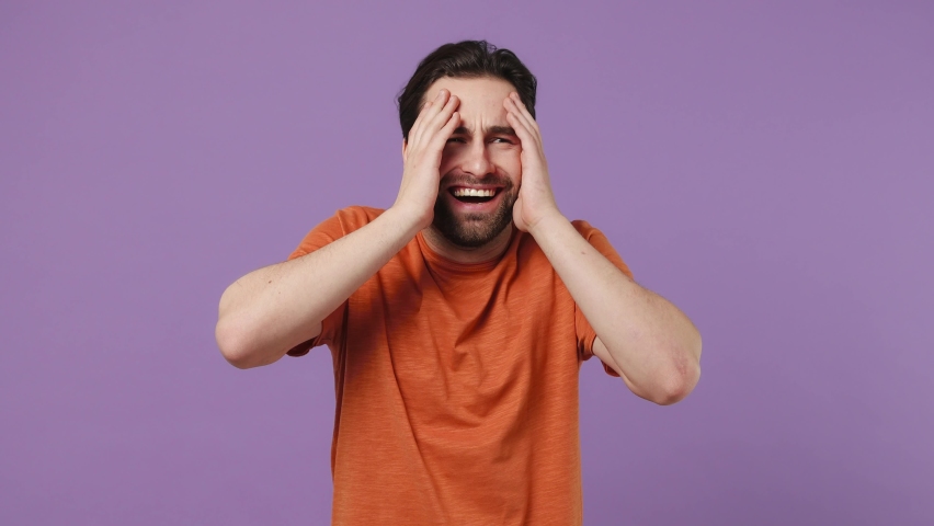 Excited cheerful young brunet bearded man 20s years old wears red t-shirt laugh smiling watch comedy movie pointing index finger on you isolated on plain pastel light purple background studio portrait Royalty-Free Stock Footage #1090058641
