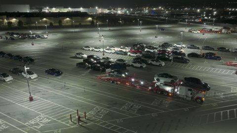 Tesla factory, Fremont, USA. Feb. 2022. Largest auto plant in North America, producing EV cars. Drone shot shows Tesla Gigafactory in California at night. High quality 4k footage