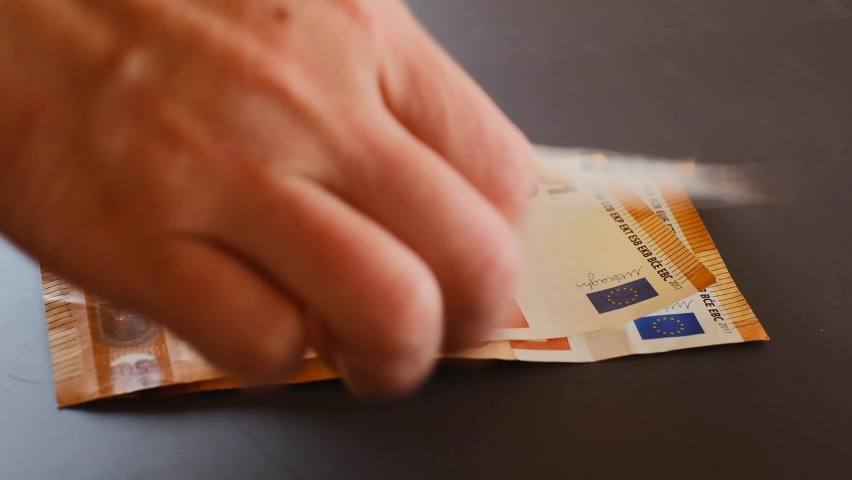 Recalculation of money.hands count euro bills on gray background. fifty euros banknotes pack. Euro banknotes in hands close-up.Euro currency. Money in hands. High quality 4k footage | Shutterstock HD Video #1090067095
