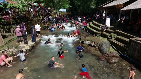 Kuningan, Indonesia - May 5, 2022: Cipaniis spring tourism in Kuningan is crowded with visitors during holidays.