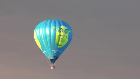 Beautiful view of Shrek hot air balloon in stormy cloudy sky.  Sweden. Uppsala. 05.10.2022.