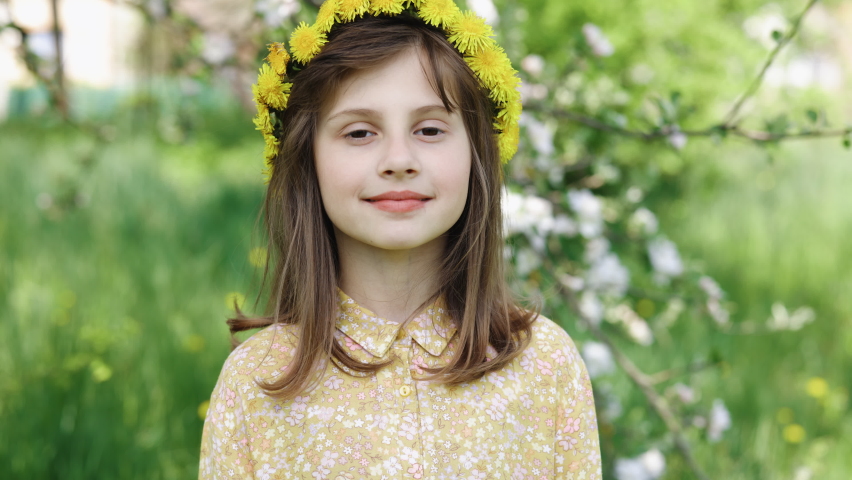Open Eyes Portrait Little Child Girl Looking at Camera Standing on Park in City. Portrait Funny little girl smiling child with pretty face looking at camera outdoors. Concept of a happy childhood. | Shutterstock HD Video #1090071731