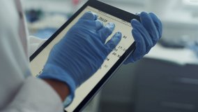 Doctor hands using tablet checking health history data in clinic office close up. Unknown physician magnifying image tables watching vaccination results on pad screen. Modern technologies in hospital. - Powered by Shutterstock - Get 15% off with code: PIKWIZARD15