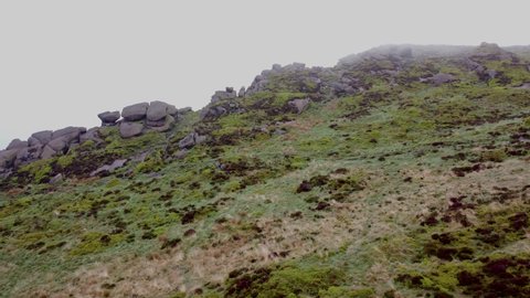 4K landscape drone footage. Generic UK bleak moorland at The Roaches in the Peak District National Park, Staffordshire, UK.