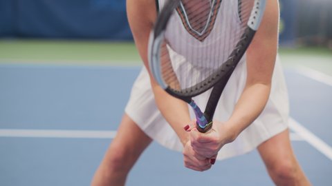 Potrait of Female Tennis Player Holding the Racquet During Championship Match, Ready for Receive Ball Strike. Confident Competitive Professional Woman Athlete. Sports Playback. Elevating Focus on Face