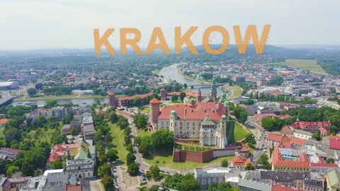 Inscription on video. Krakow, Poland. Wawel Castle. Ships on the Vistula River. View of the historic center. Appears from the sand, Aerial View, Point of interest