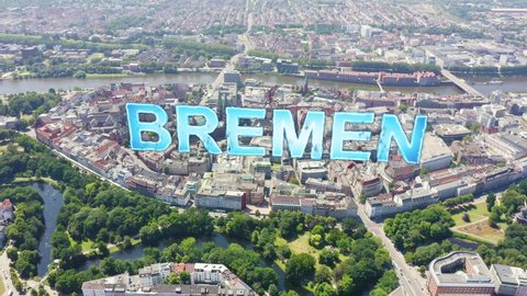 Inscription on video. Bremen, Germany. The historic part of Bremen, the old town. Bremen Cathedral ( St. Petri Dom Bremen ). View in flight. Arises from blue water, Aerial View, Departure of the came