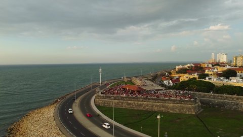 Cartagena de Indias, Colombia: Aerial drone footage of the road along the Cartagena colonial city wall and the Bastion de Santo Domingo along the Caribean sea in Colombia in south America. 