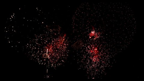 Colorful Firework Displays lighting up the sky at night in Slow Motion
