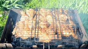 Meat on  barbecue grill , rosted chicken outdoors. Picnic party and process of preparing meat, shashlyk