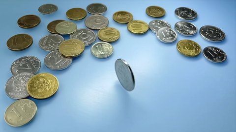 Metal Russian ruble coin rotating and falling on blue background in Slow motion. Five rubles. Russian money. RF national currency. Money exchange rate, volatility. Cost of money. Ruble inflation.