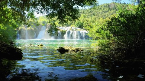 KRKA NATIONAL PARK, CROATIA - SEPTEMBER 3, 2021: Waterfall and turquoise water in summer in Krka National Park, Croatia. 4K, Ultra-wide, 60 fps. Contains audio