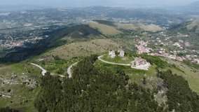 Ancient Norman Castle with the Sanctuary of Maria SS. della Misericordia, located on the chain of the Tifatini Mountains, southern Italy. Castel Morrone, Italy, May 04, 2022.