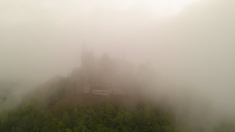 Aerial Shot Of Famous Palace On Tranquil Hill Top, Drone Flying In Fog - Bisingen, Germany