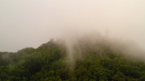 Aerial Panning Tranquil Scene Of Famous Castle On Hill Top During Foggy Environment - Bisingen, Germany