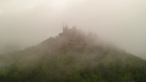 Aerial Forward Shot Of Famous Fort On Hill Top During Foggy Weather - Bisingen, Germany