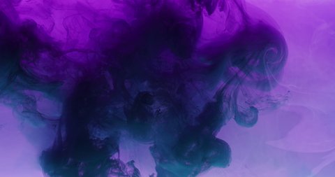 Color smoke cloud. Ink water swirl. Underwater explosion. Intro reveal. Neon purple blue smog mix on dark abstract background shot on RED Cinema camera.