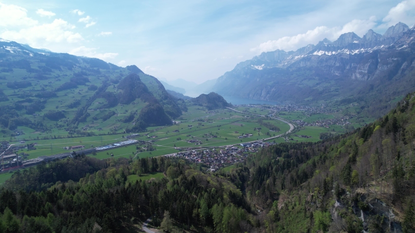 Beautiful Swiss town of Walenstadt in Switzerland, Europe, aerial view of valley surrounded by Swiss Alps.