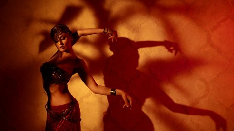 hypnotic and seductive dance of beautiful woman in ancient style, professional belly dancer