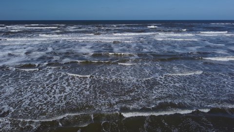 Schiermonnikoog,Friesland,The Netherlands,05-08-2022.Flying over the north sea with waves coming in