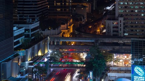 night time illumination bangkok city downtown traffic street metro line rooftop panorama 4k timelapse thailand