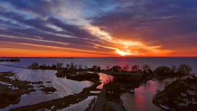 Twilight silhouettes of trees and homes amid swirling waters situated between wetlands and vast bay. I love the harmonious patterns in the clouds that seem to mimic the land forms below.
 - Powered by Shutterstock - Get 15% off with code: PIKWIZARD15