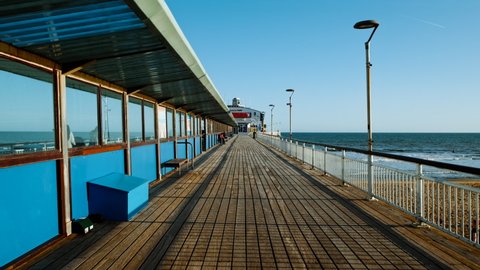 BOURNEMOUTH, circa 2022 - Establishing shot of Bournemouth Pier. Bournemouth is a seaside resort town in the county of Dorset on the south coast of England, UK
