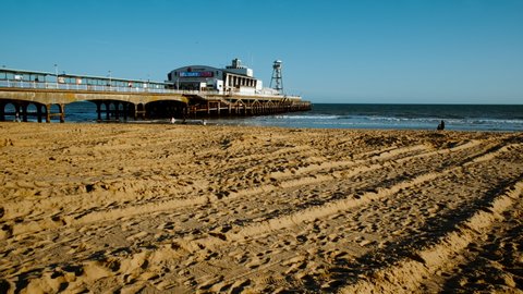 BOURNEMOUTH, circa 2022 - Establishing shot of Bournemouth Beach. Bournemouth is a seaside resort town in the county of Dorset on the south coast of England, UK

