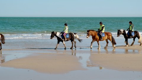POOLE, circa 2022 - Horse-riding school seen in Poole Beach, a seaside resort town in the county of Dorset on the south coast of England, UK
