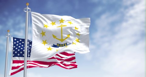 Seamless loop of the Rhode Island state flag waving along with the national flag of the United States of America. Rhode island is a state in the the Northeastern United States
