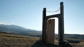 Video of Gateway to Shambhala on blue sky background. Wooden gates in Altai highlands. Altai, Siberia, Russia.