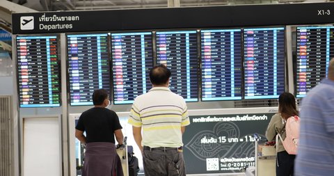 Bangkok, THAILAND - May 6 , 2022 :Flight information at a timetable at Suvarnabhumi Airport .