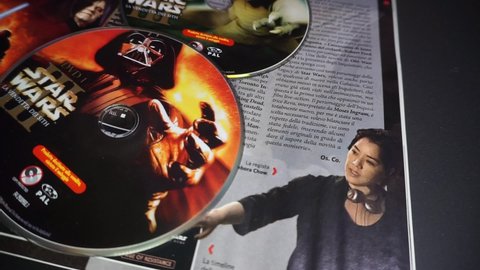 Rome, Italy - May 09, 2022, detail of the cover and dvd of the movie Star Wars III, Revenge of the Sith, and in the background the cinema magazine Ciak with a special on the new Obi Wan Kenobi series.