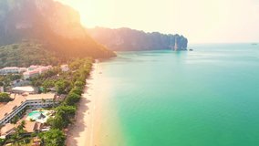 An aerial view of the unique turquoise waters of the Andaman Sea. Beautiful mountain coast. Aonang, Krabi, Thailand. 4K drone footage. nature and travel concept.

