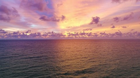 Aerial view Beautiful view sunset or sunrise over sea surface beautiful wave Amazing light twilight sky sunset. Cinematic drone shot dynamic footage beautiful light of nature seascape