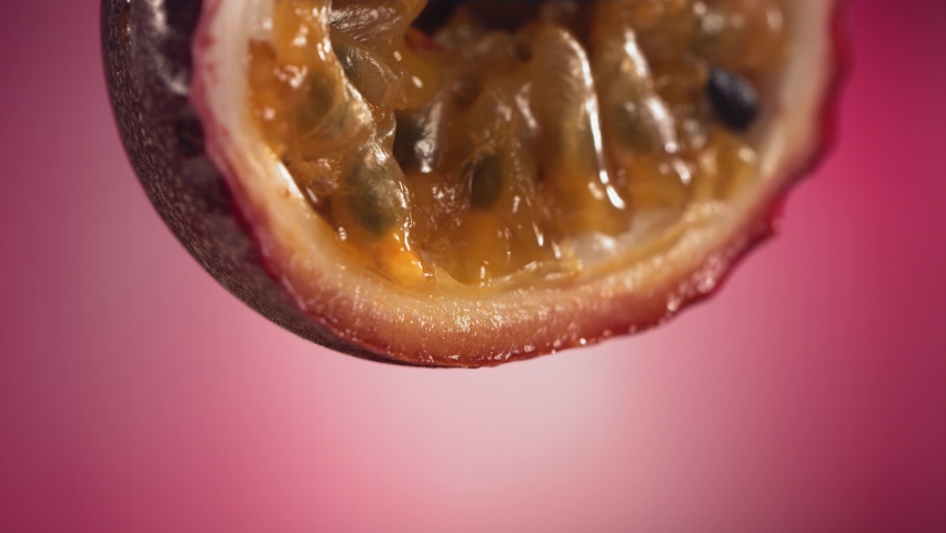 Slow Motion Macro Shot of Flowing Passion Fruit Maracuya Juice from Halved Maracuya Royalty-Free Stock Footage #1090108895