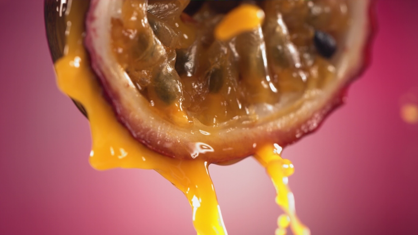 Slow Motion Macro Shot of Flowing Passion Fruit Maracuya Juice from Halved Maracuya | Shutterstock HD Video #1090108895