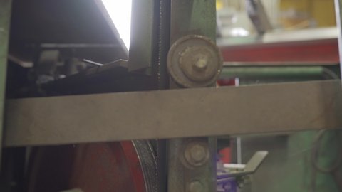 Closeup Of A Saw Blade Rotating On A Industrial Bandsaw