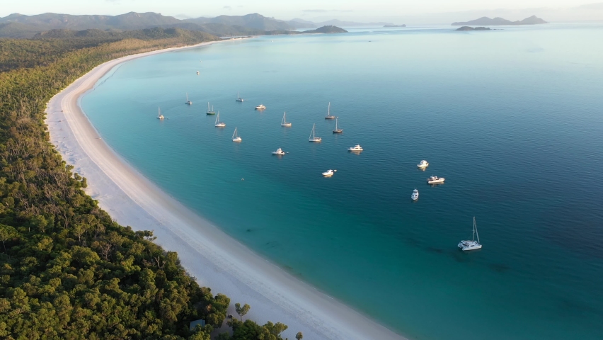 Whitehaven Beach Whitsundays aerial tracking backwards with boats, Queensland Royalty-Free Stock Footage #1090110049
